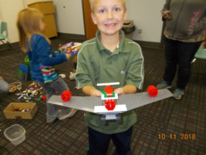 Boy and Lego Stealth plane