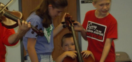 children holding cello
