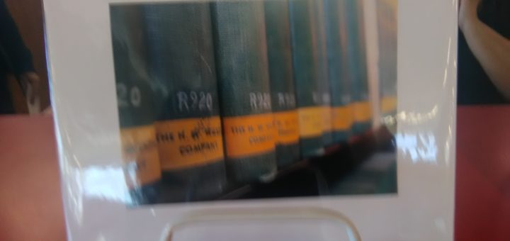 photo of 7 books with green spines and dewey numbers