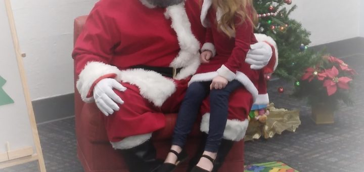 C telling Santa what she wants for Christmas