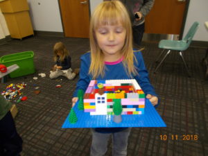 Young girl and a Lego landscape