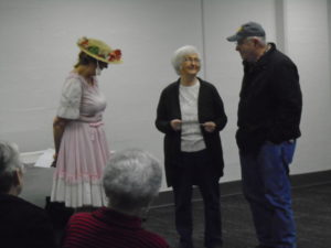 2 audience members interacting with Minnie Pearl