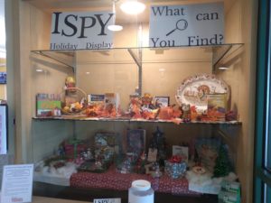 Display case with thanksgiving and Christmas items for ISpy
