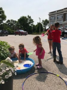 kids at a bubble station